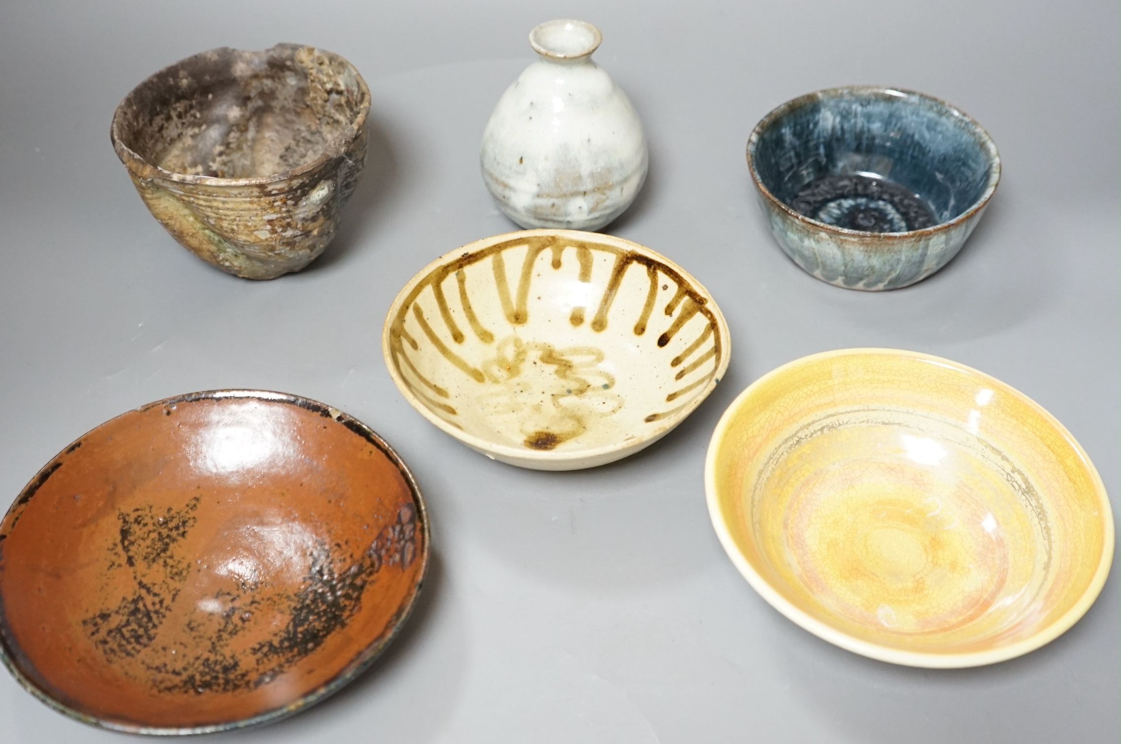 Studio pottery; a group of three bowls, a tenmoku dish, a small vase and a large cup, some marked, tallest 12cm, (6)